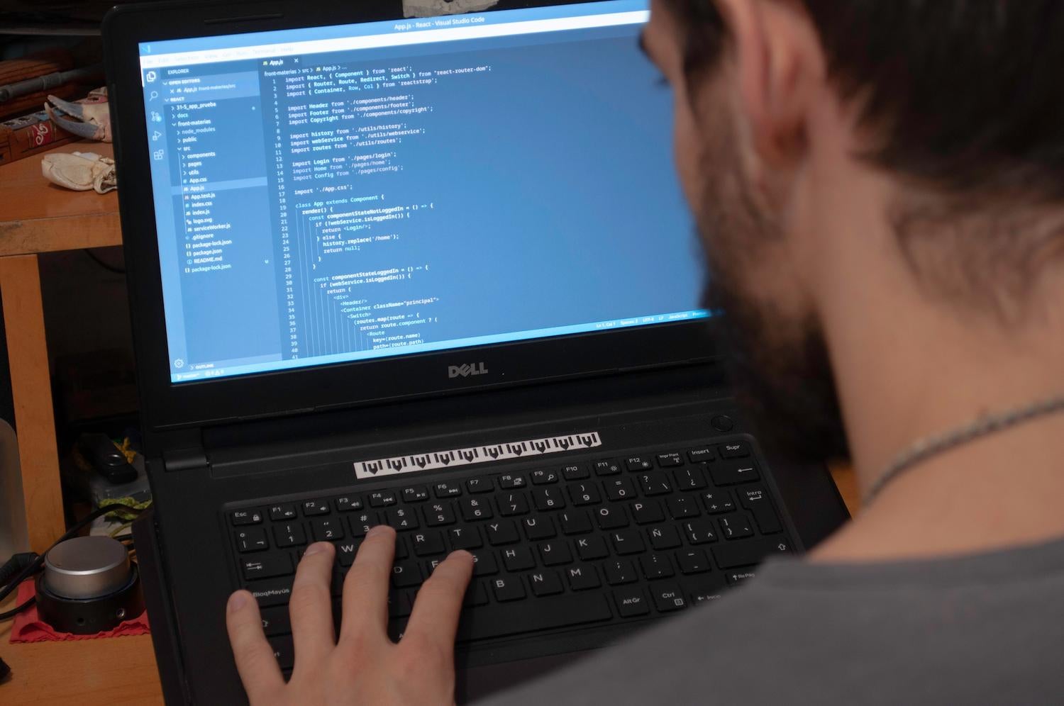 a programmer by his laptop
