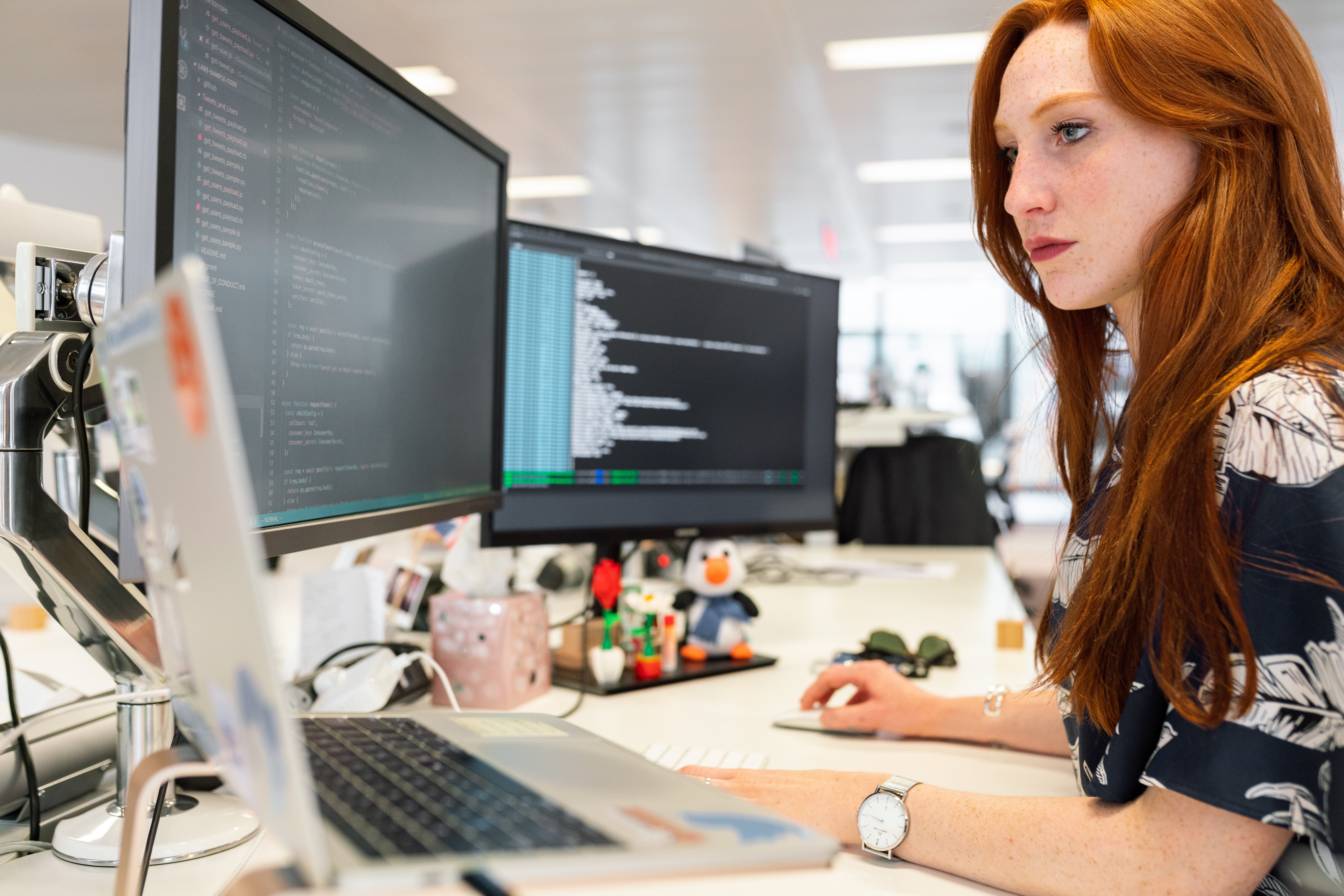 A woman coding during her work